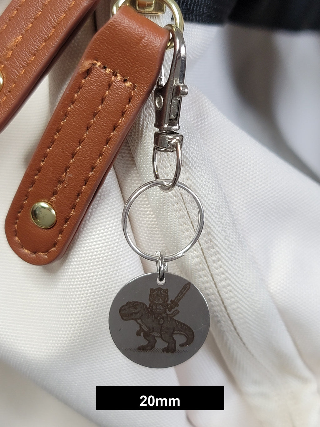 Muffin on his T-Rex Engraved Fob