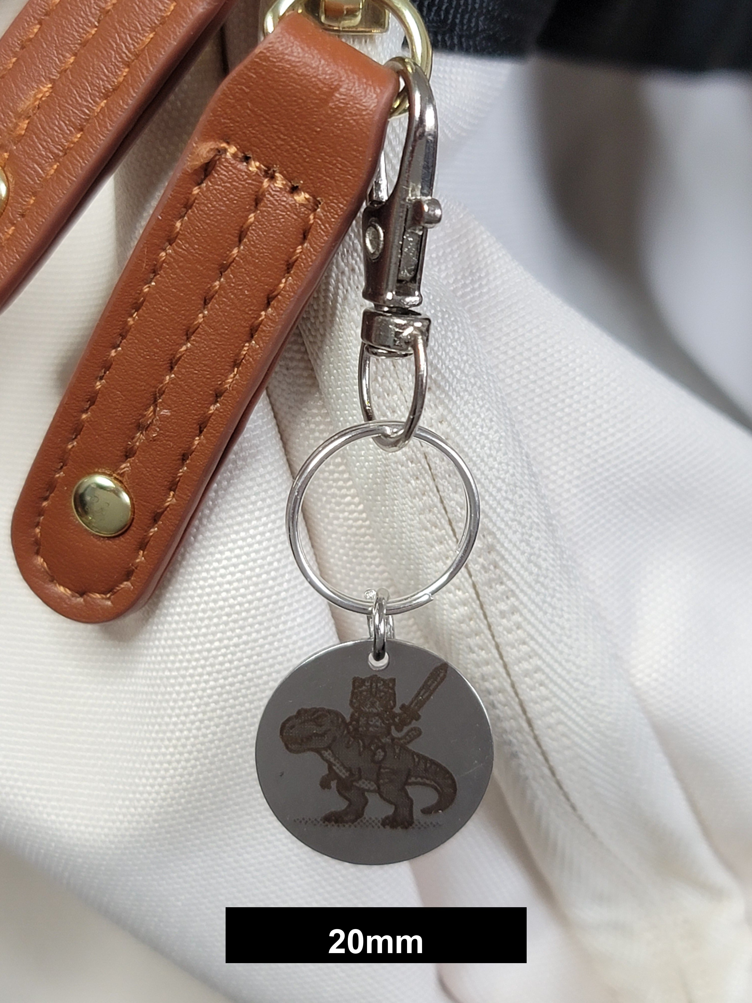 Muffin on his T-Rex Engraved Fob