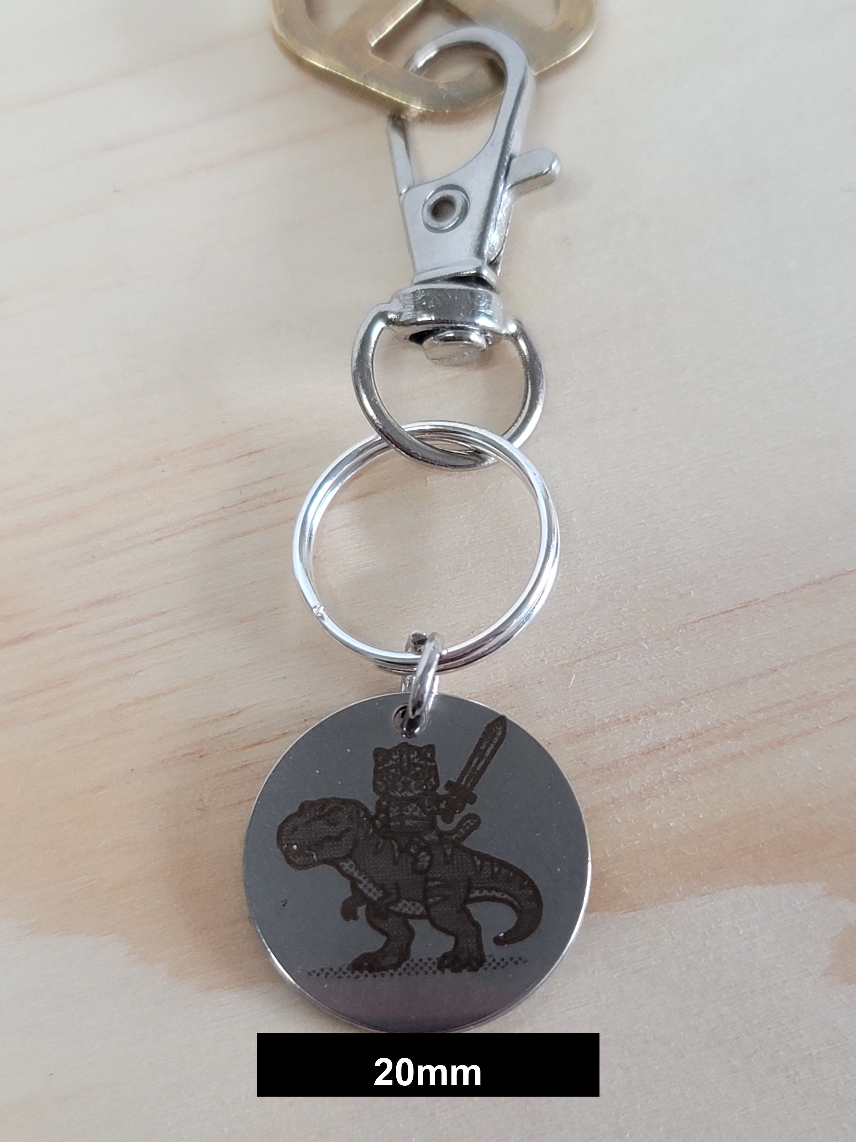 Muffin on his T-Rex Engraved Fob