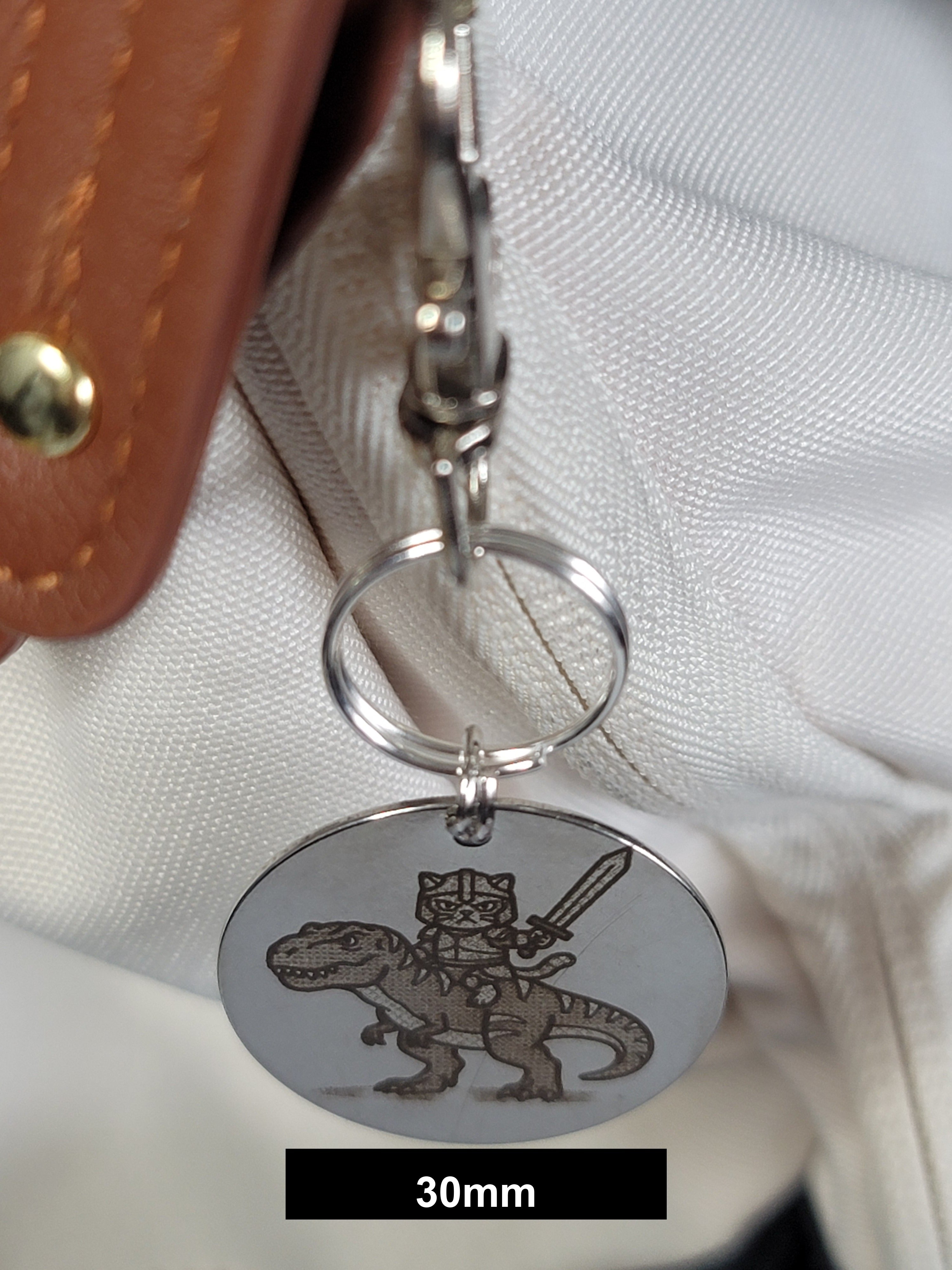 Muffin on his T-Rex Engraved Fob