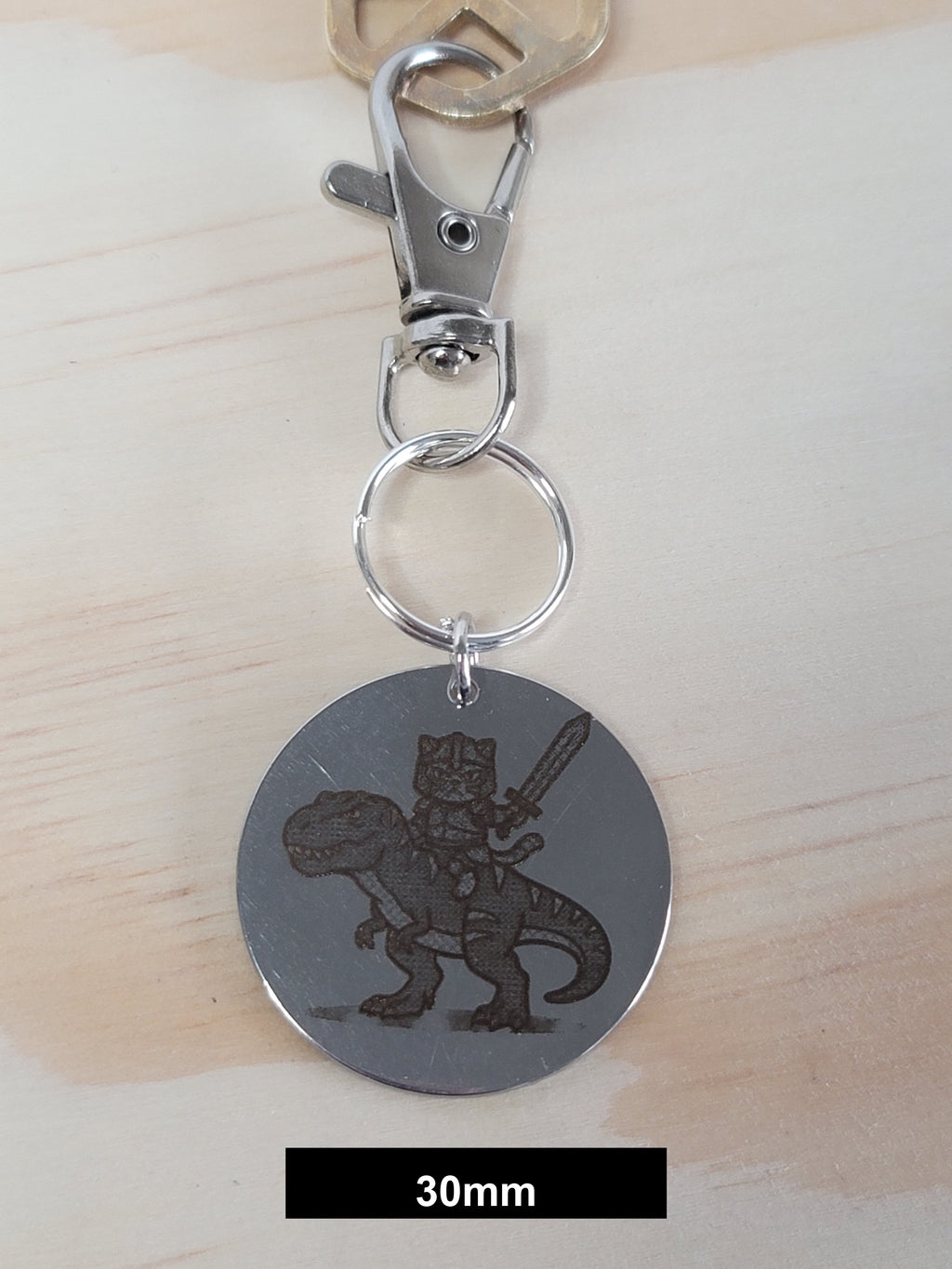 Muffin on his T-Rex Engraved Fob